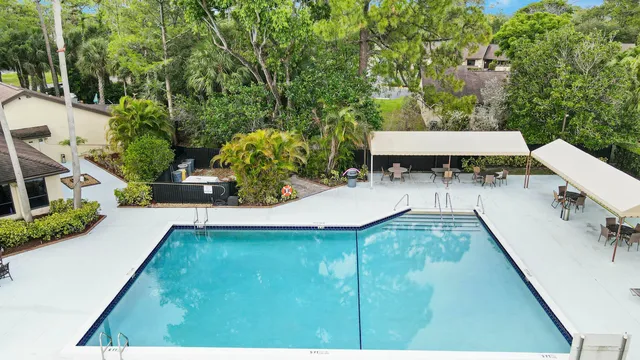 an aerial view of house with yard