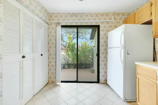 a view of a livingroom with a refrigerator