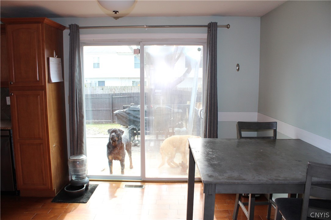4195 Burningtree Road Clay, NY 13090 - Photo 5 of 28 Dining, slider to back yard. Dogs not included.
