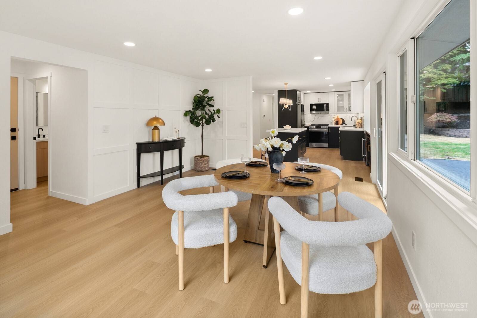 21807 3rd Place West Bothell, WA 98021 - Photo 14 of 32 a view of a dining room with furniture window and wooden floor