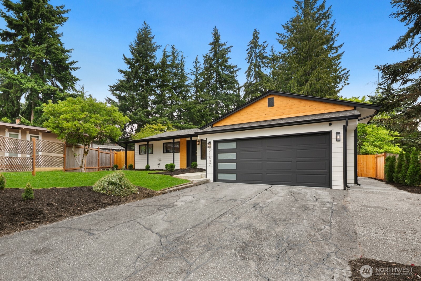 21807 3rd Place West Bothell, WA 98021 - Photo 2 of 32 a front view of a house with a yard and garage