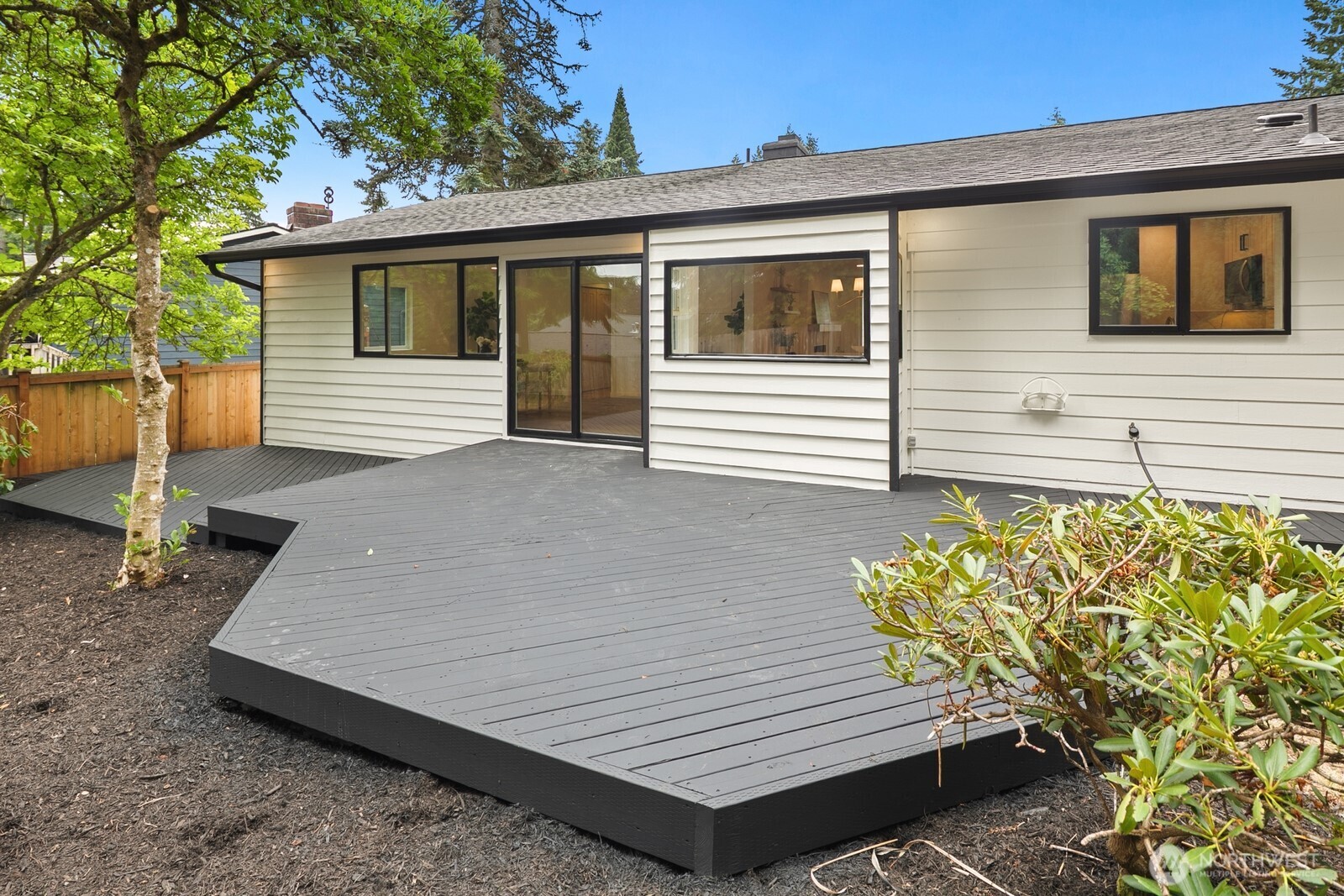 21807 3rd Place West Bothell, WA 98021 - Photo 25 of 32 a view of a wooden bench in the backyard