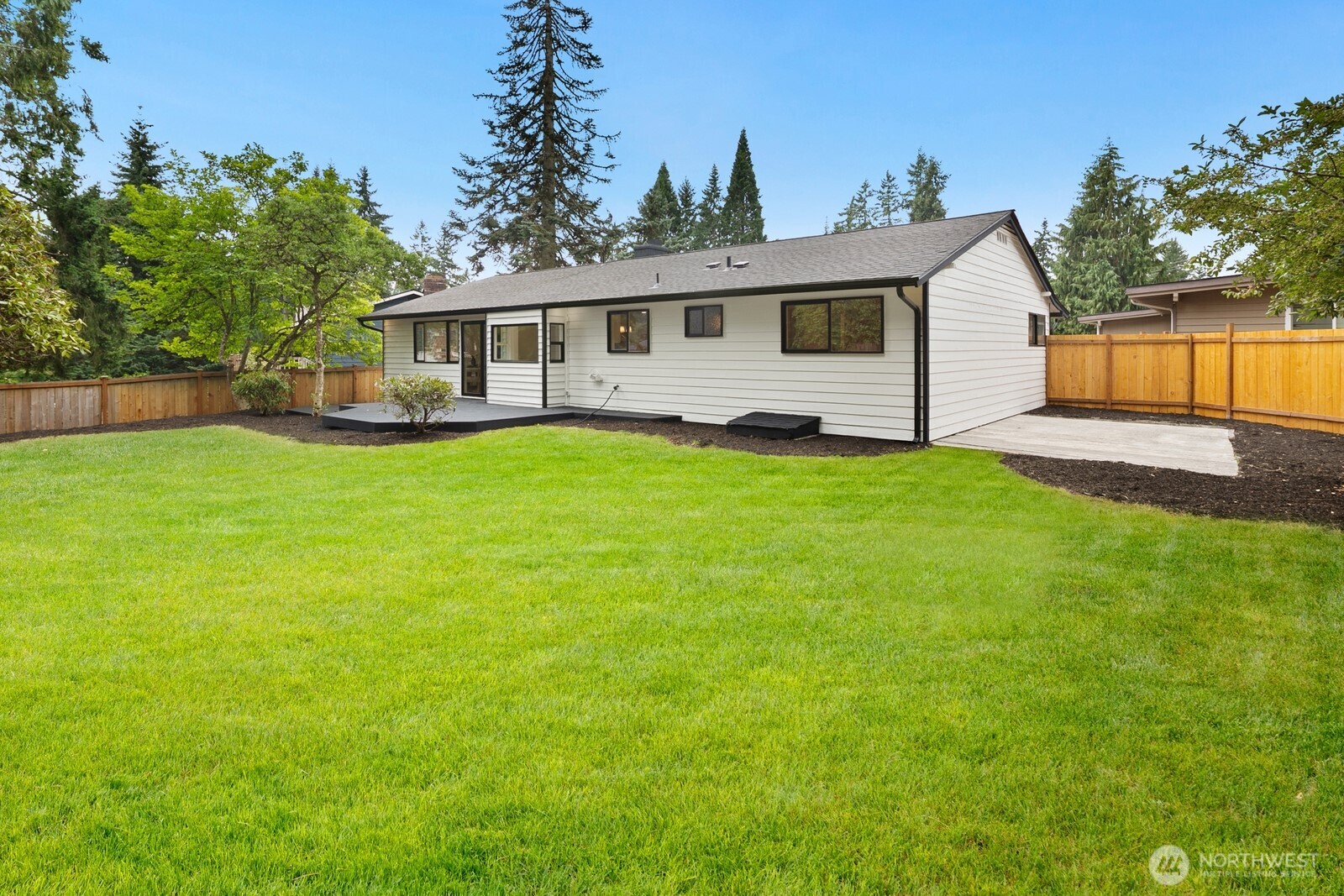 21807 3rd Place West Bothell, WA 98021 - Photo 28 of 32 a front view of a house with a garden