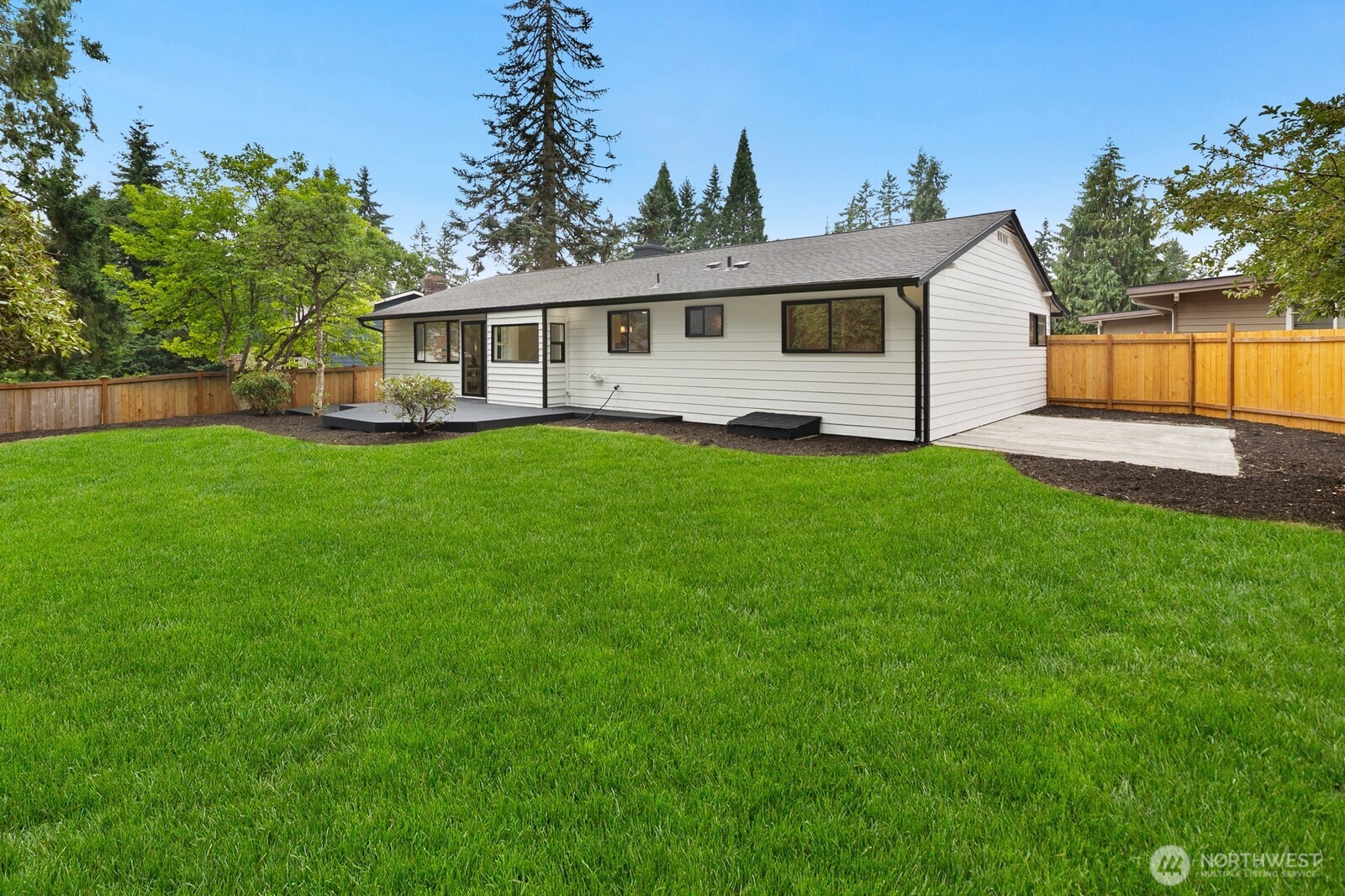 21807 3rd Place West Bothell, WA 98021 - Photo 29 of 32 a front view of a house with a garden