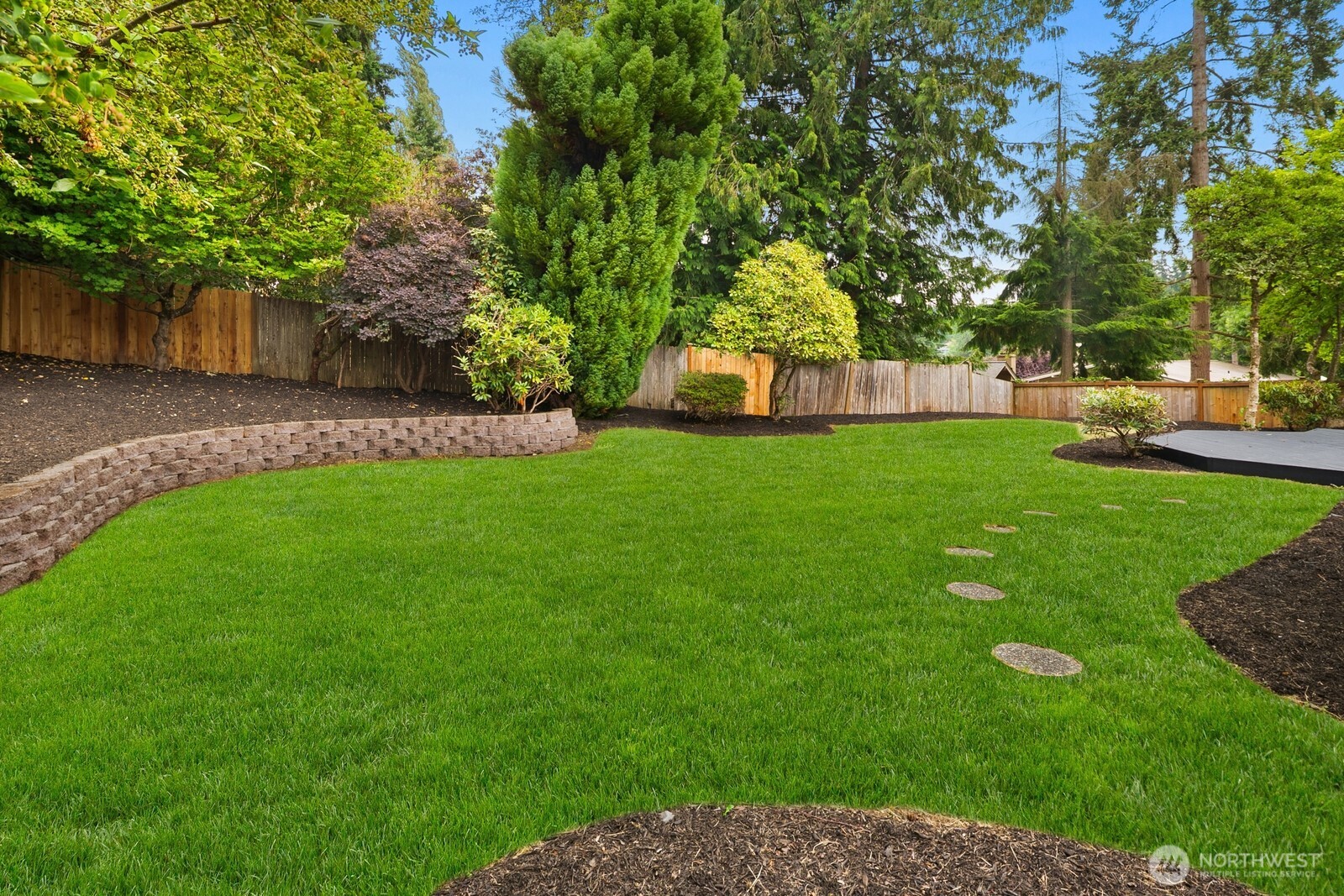 21807 3rd Place West Bothell, WA 98021 - Photo 30 of 32 a view of a backyard with large trees