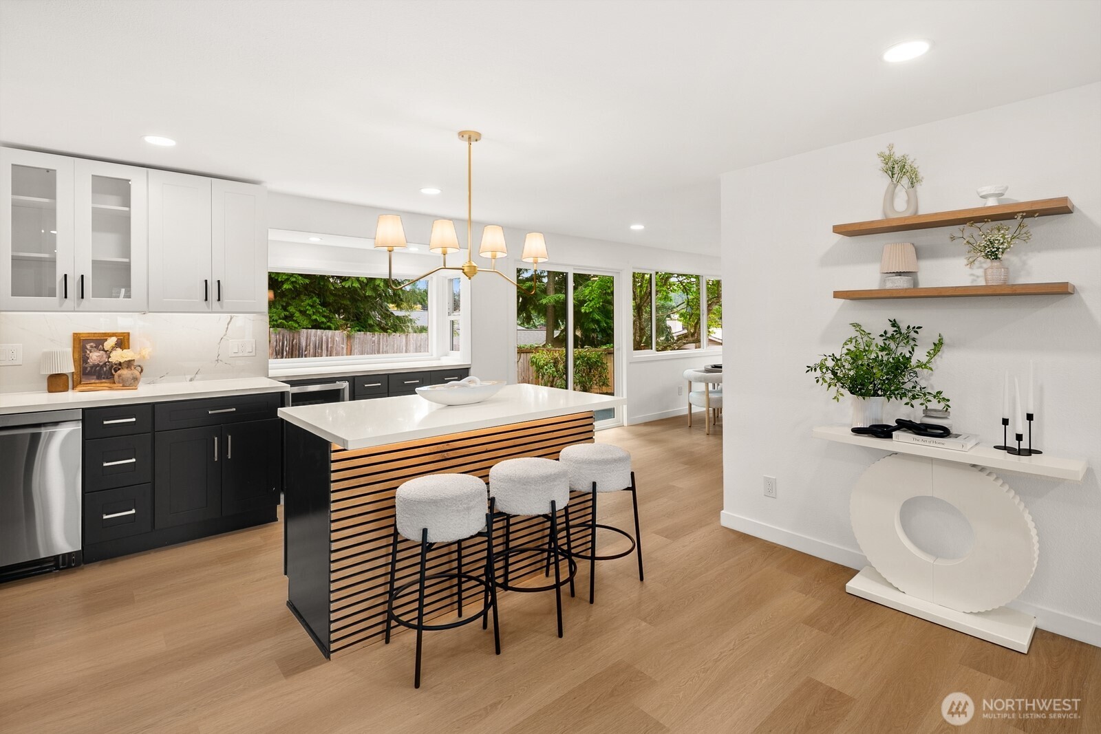 21807 3rd Place West Bothell, WA 98021 - Photo 6 of 32 a kitchen with stainless steel appliances granite countertop sink stove and wooden floor