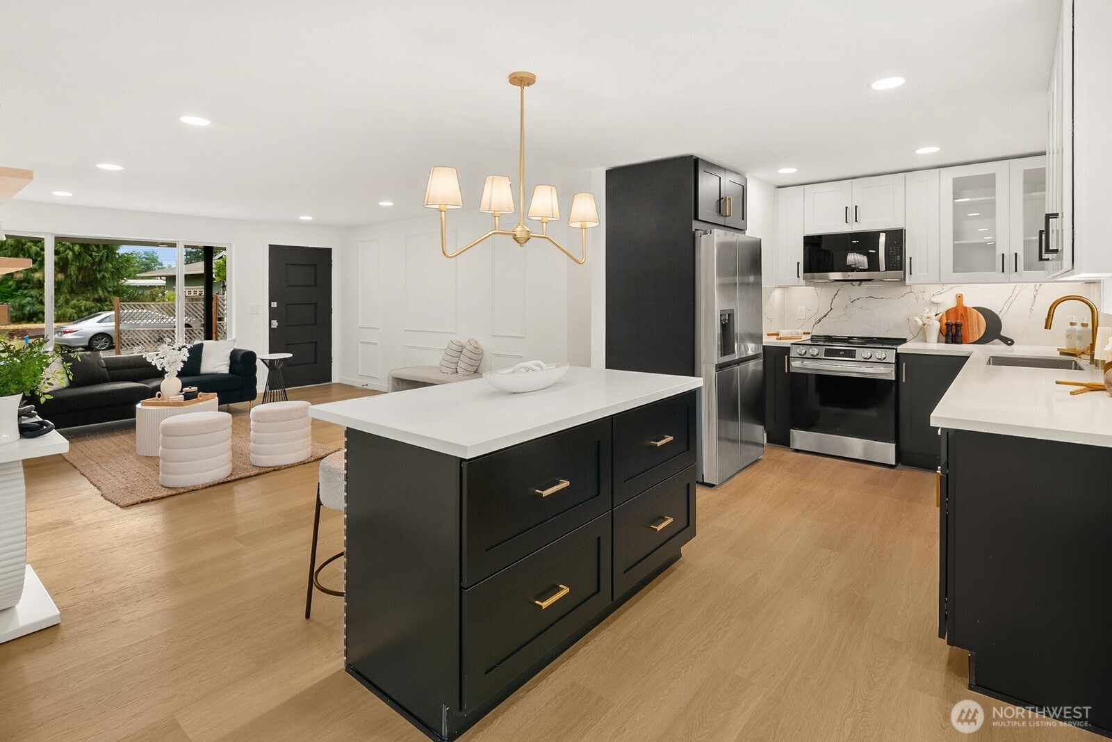 21807 3rd Place West Bothell, WA 98021 - Photo 8 of 32 a kitchen with stainless steel appliances sink stove refrigerator and microwave