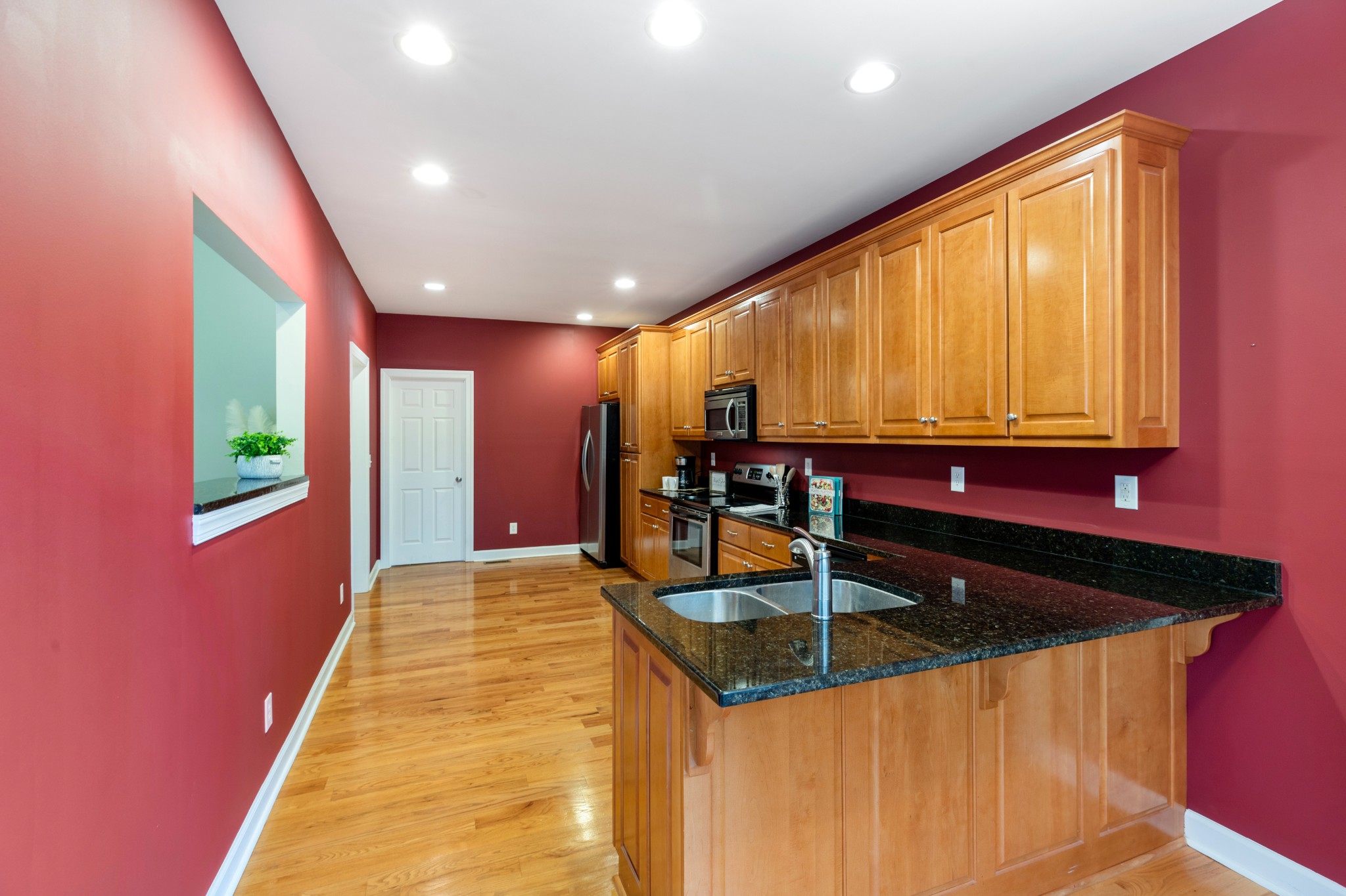 100 Kimberly Way Dickson, TN 37055 - Photo 16 of 34 a kitchen with stainless steel appliances a large window in it