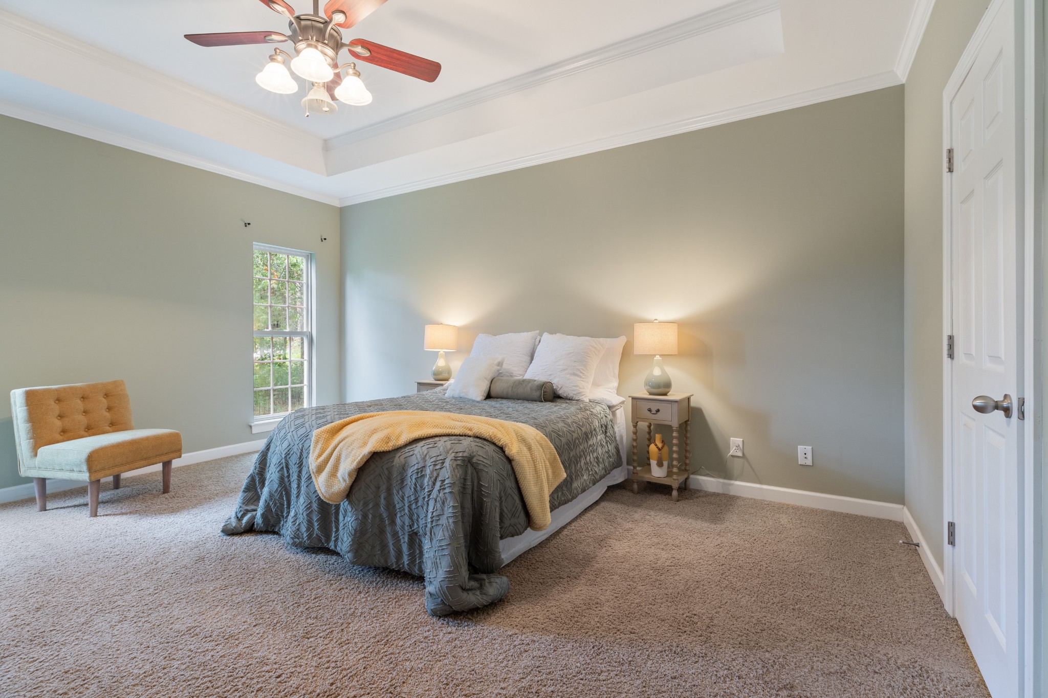 100 Kimberly Way Dickson, TN 37055 - Photo 22 of 34 a spacious bedroom with a bed and a chandelier