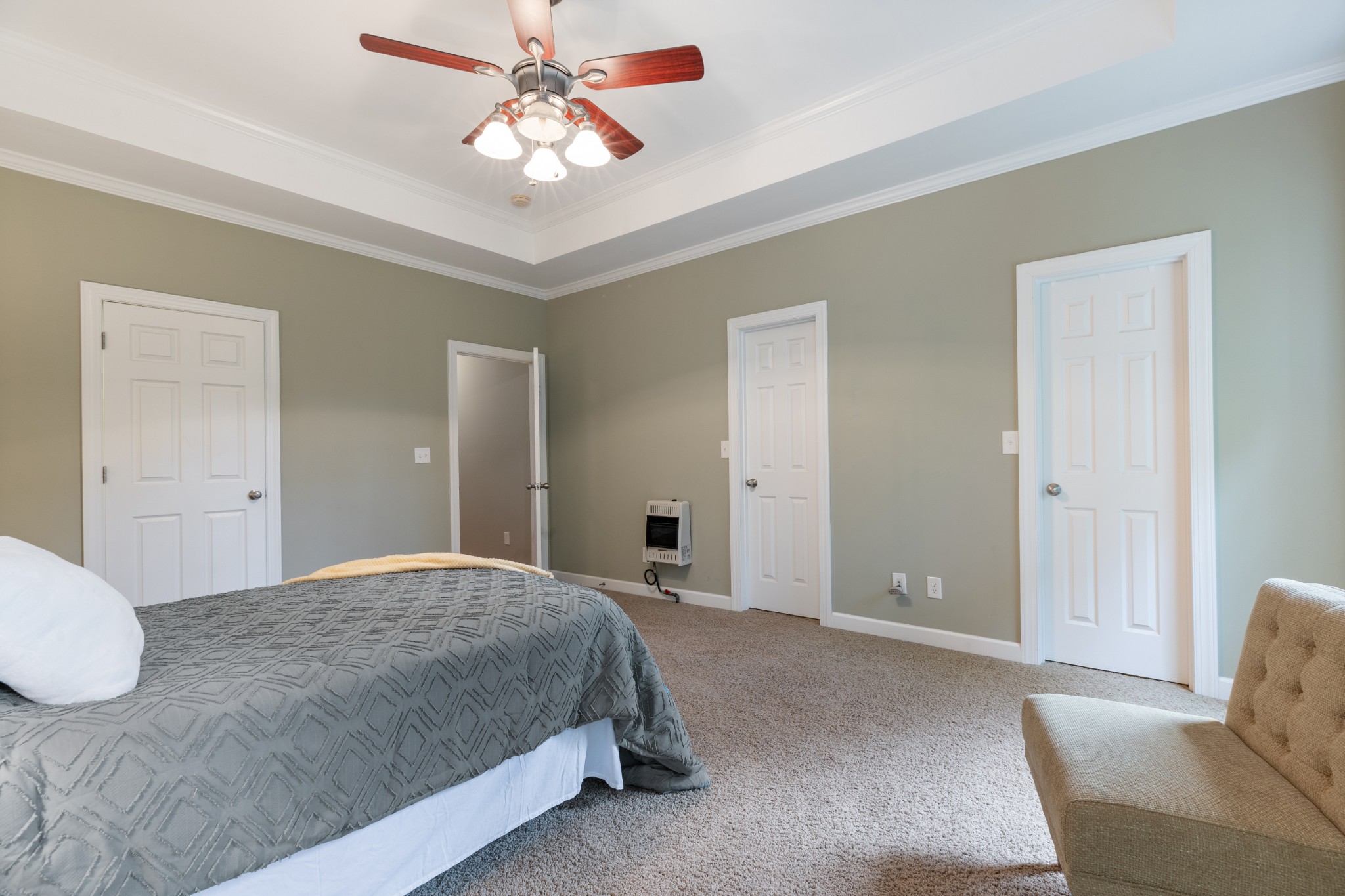 100 Kimberly Way Dickson, TN 37055 - Photo 23 of 34 a bedroom with a bed and a chandelier