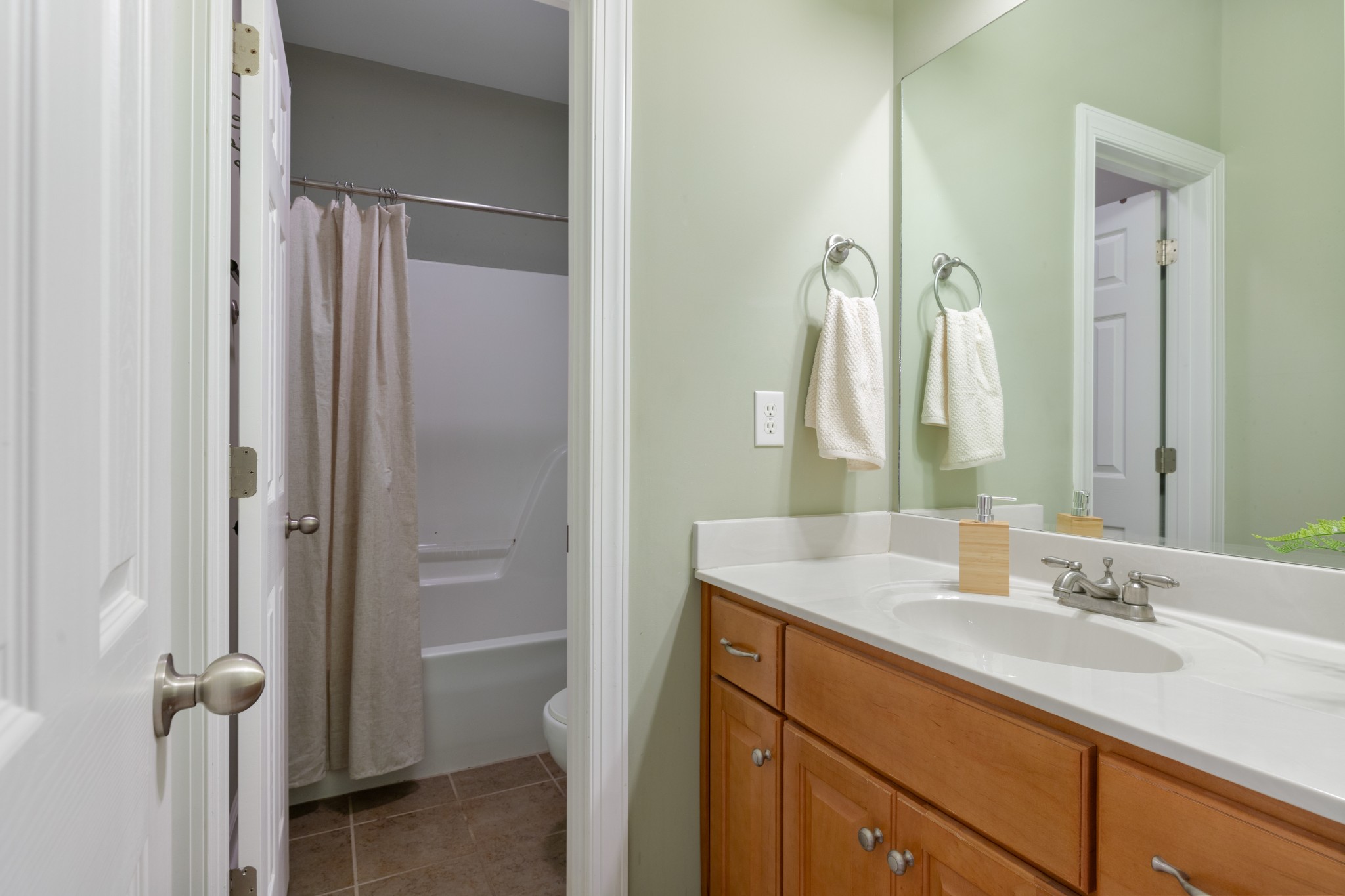 100 Kimberly Way Dickson, TN 37055 - Photo 28 of 34 a bathroom with a sink and a mirror