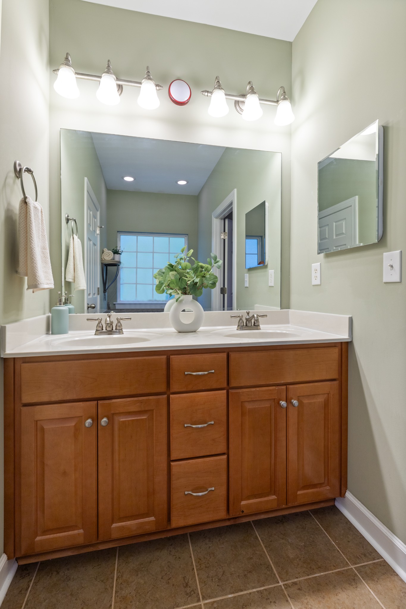 100 Kimberly Way Dickson, TN 37055 - Photo 29 of 34 a bathroom with a double vanity sink and a mirror