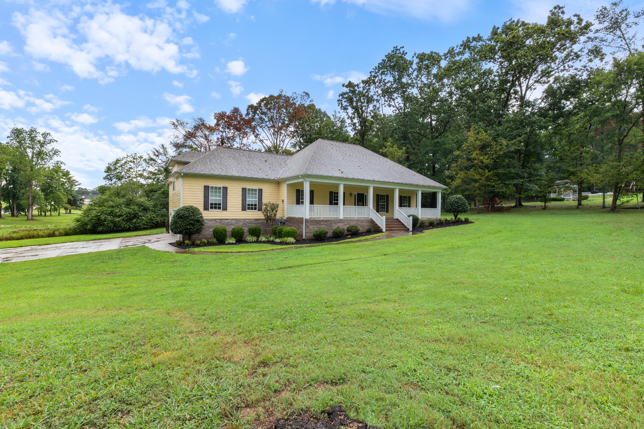 100 Kimberly Way Dickson, TN 37055 - Photo 3 of 34 a front view of a house with garden