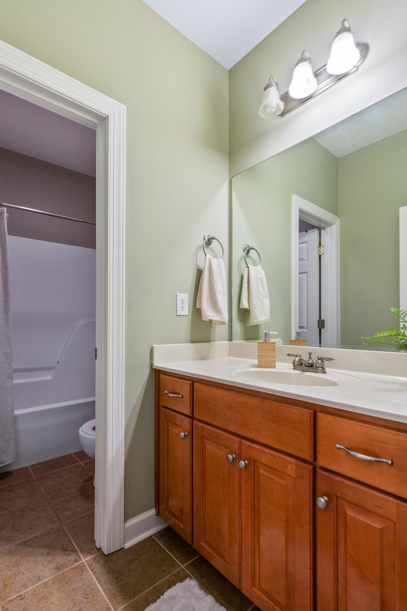 100 Kimberly Way Dickson, TN 37055 - Photo 31 of 34 a bathroom with a double vanity sink and a mirror