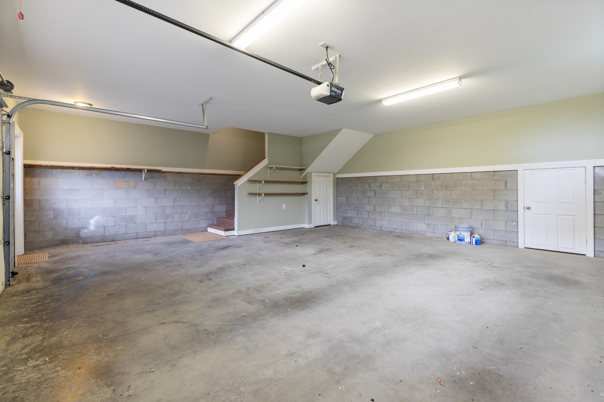 100 Kimberly Way Dickson, TN 37055 - Photo 32 of 34 an empty room with windows and a ceiling fan