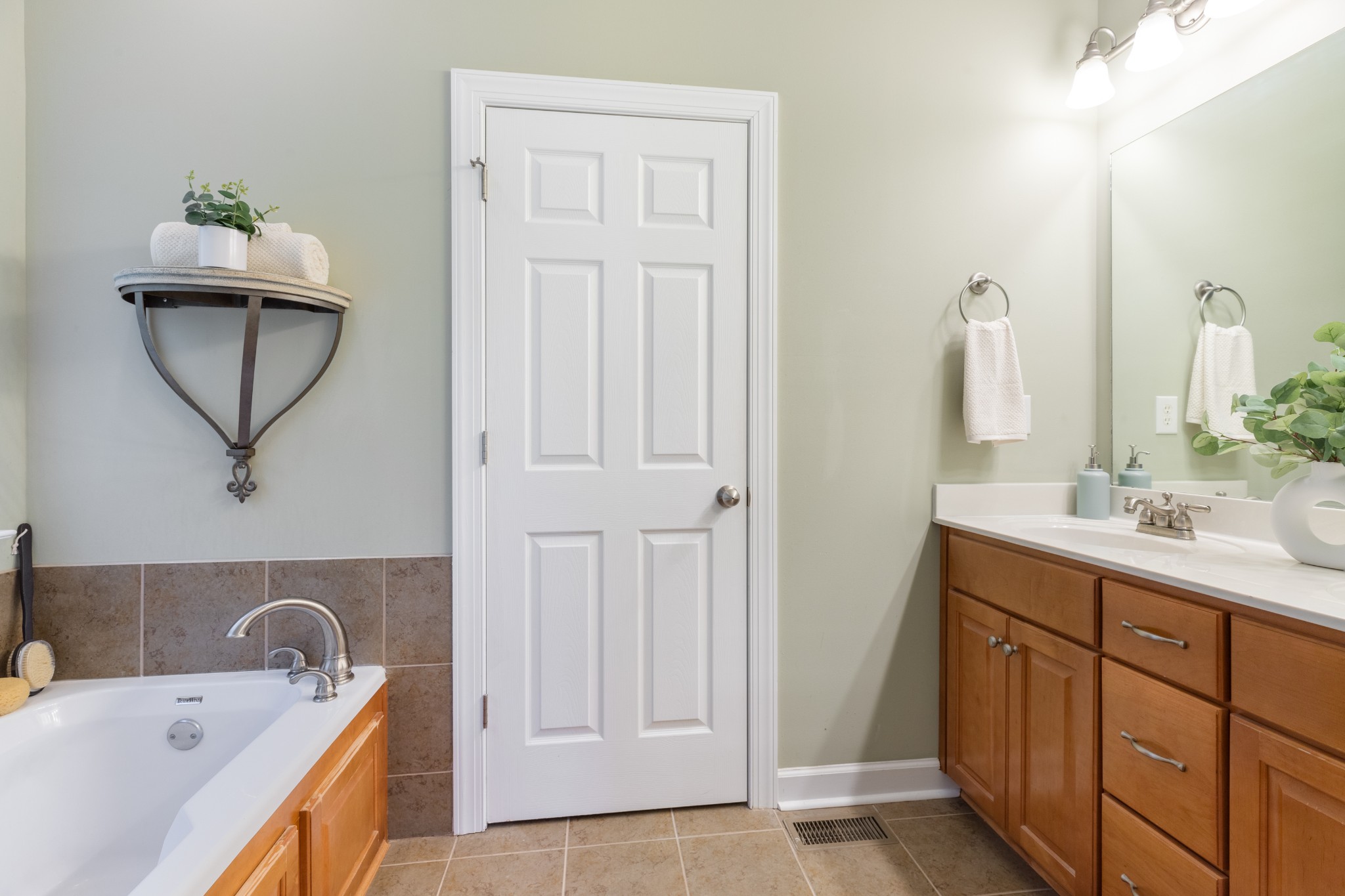 100 Kimberly Way Dickson, TN 37055 - Photo 33 of 34 a bathroom with a tub sink and mirror