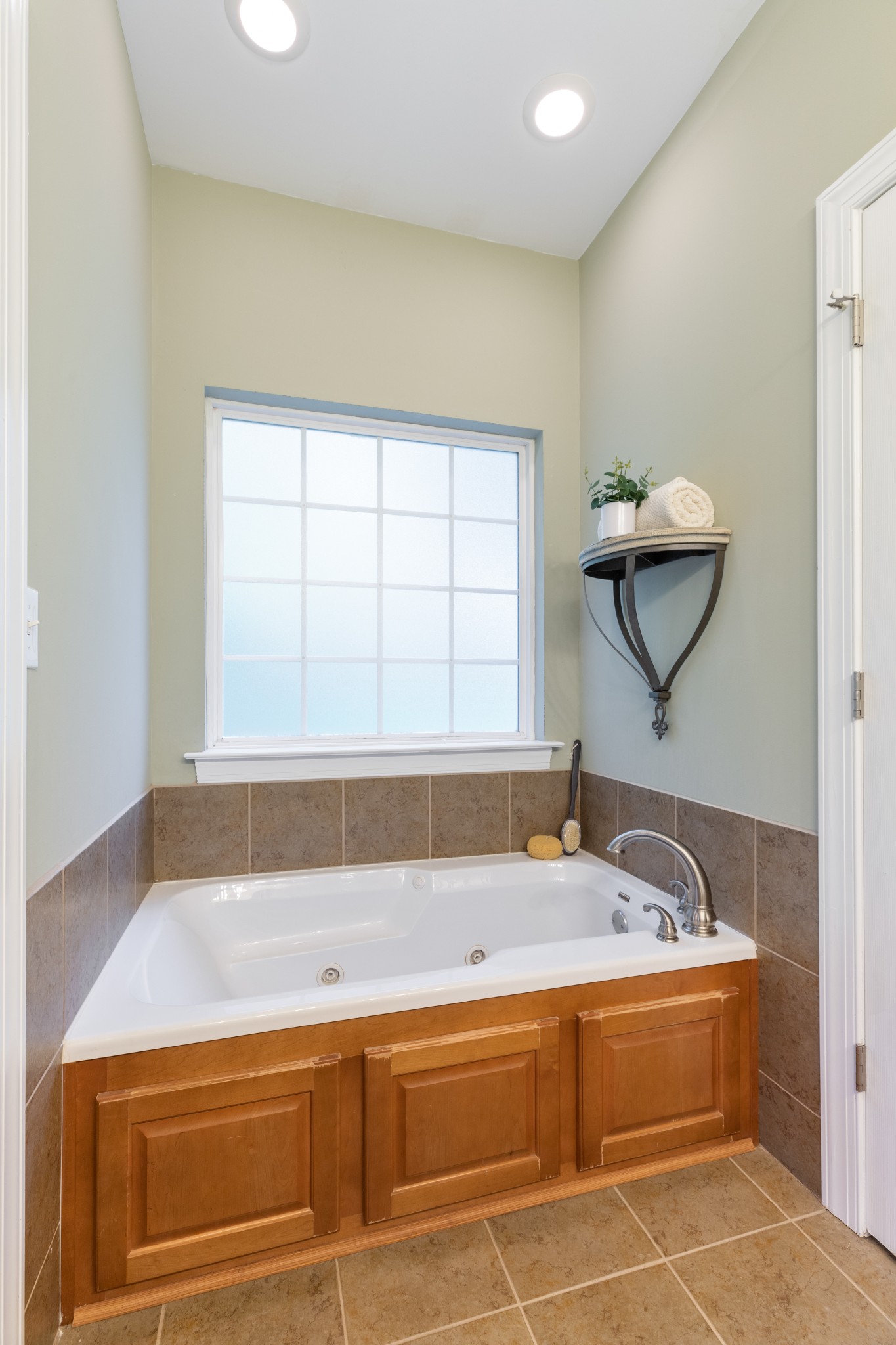 100 Kimberly Way Dickson, TN 37055 - Photo 34 of 34 a bathroom with a bathtub and a window
