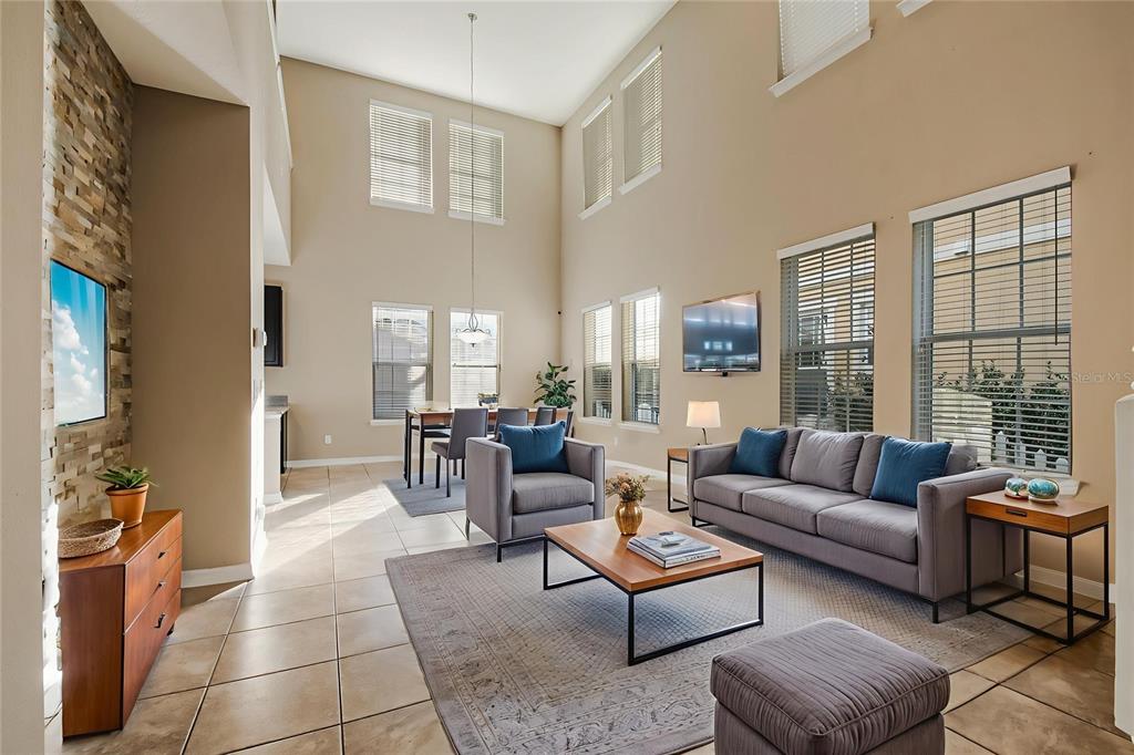 6844 Sundrop Street Harmony, FL 34773 - Photo 12 of 67 a living room with furniture and a large window