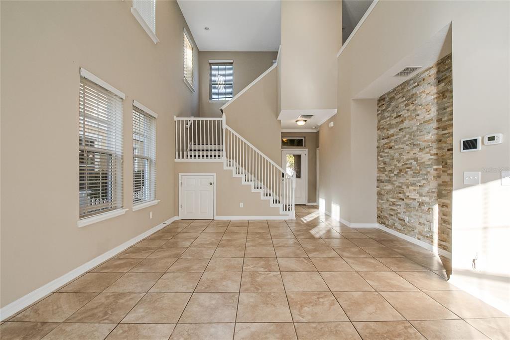 6844 Sundrop Street Harmony, FL 34773 - Photo 17 of 67 a view of an empty room with windows