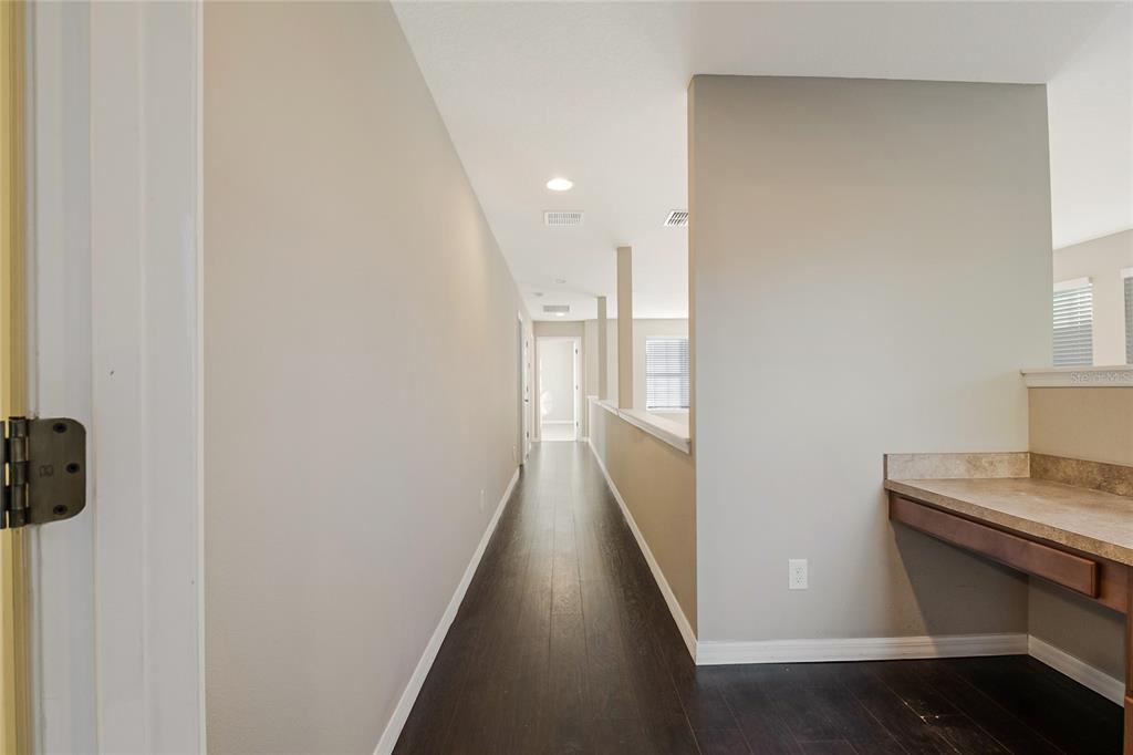 6844 Sundrop Street Harmony, FL 34773 - Photo 28 of 67 a view of a hallway with furniture
