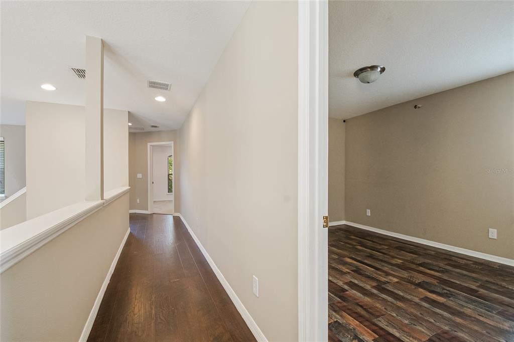 6844 Sundrop Street Harmony, FL 34773 - Photo 35 of 67 a view of a hallway