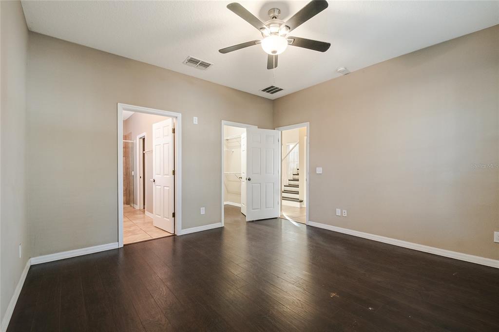 6844 Sundrop Street Harmony, FL 34773 - Photo 37 of 67 a view of an empty room with wooden floor