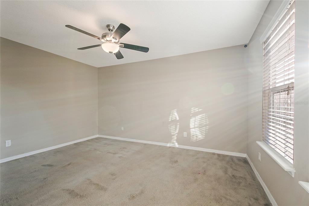 6844 Sundrop Street Harmony, FL 34773 - Photo 43 of 67 wooden floor in an empty room with a window
