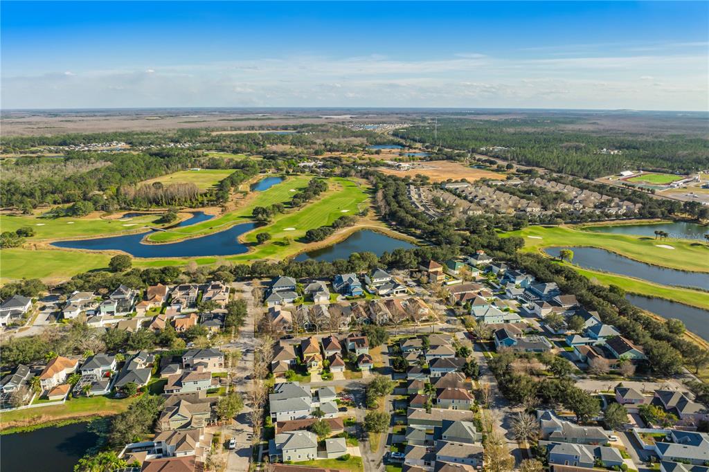 6844 Sundrop Street Harmony, FL 34773 - Photo 55 of 67 an aerial view of ocean and residential houses with outdoor space