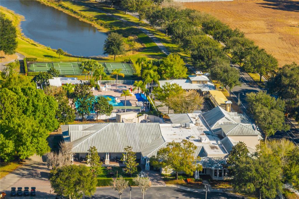 6844 Sundrop Street Harmony, FL 34773 - Photo 56 of 67 an aerial view of a building with an outdoor space and seating area