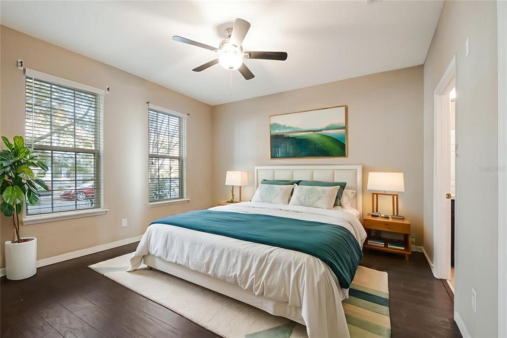 6844 Sundrop Street Harmony, FL 34773 - Photo 9 of 67 a bedroom with a large bed chandelier and a window