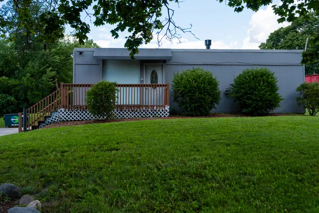 a view of a house with a back yard