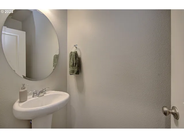 a bathroom with a sink and mirror