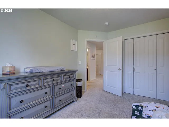 a view of room with cabinet and mirrors