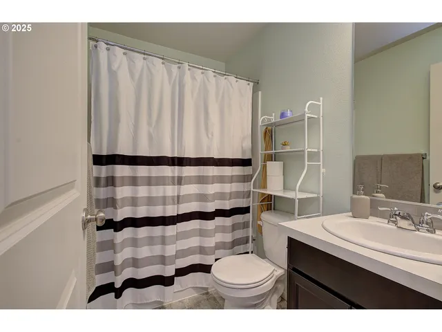 a view of a hallway with washer and dryer