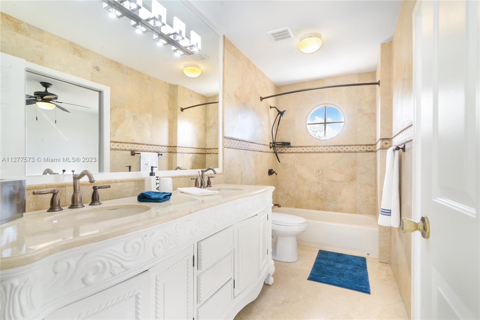 Silver Falls Miramar, FL 33027 - Photo 24 of 46 a bathroom with a sink a toilet a mirror and shower