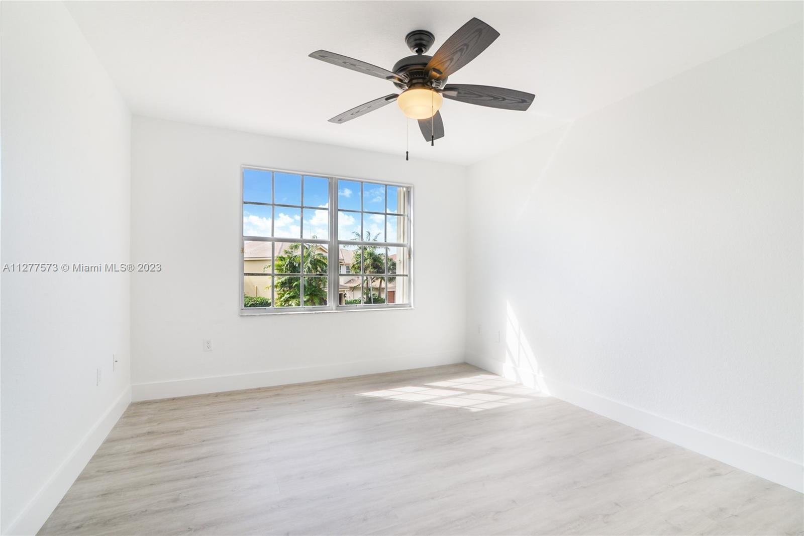 Silver Falls Miramar, FL 33027 - Photo 25 of 46 an empty room with a window and a ceiling fan
