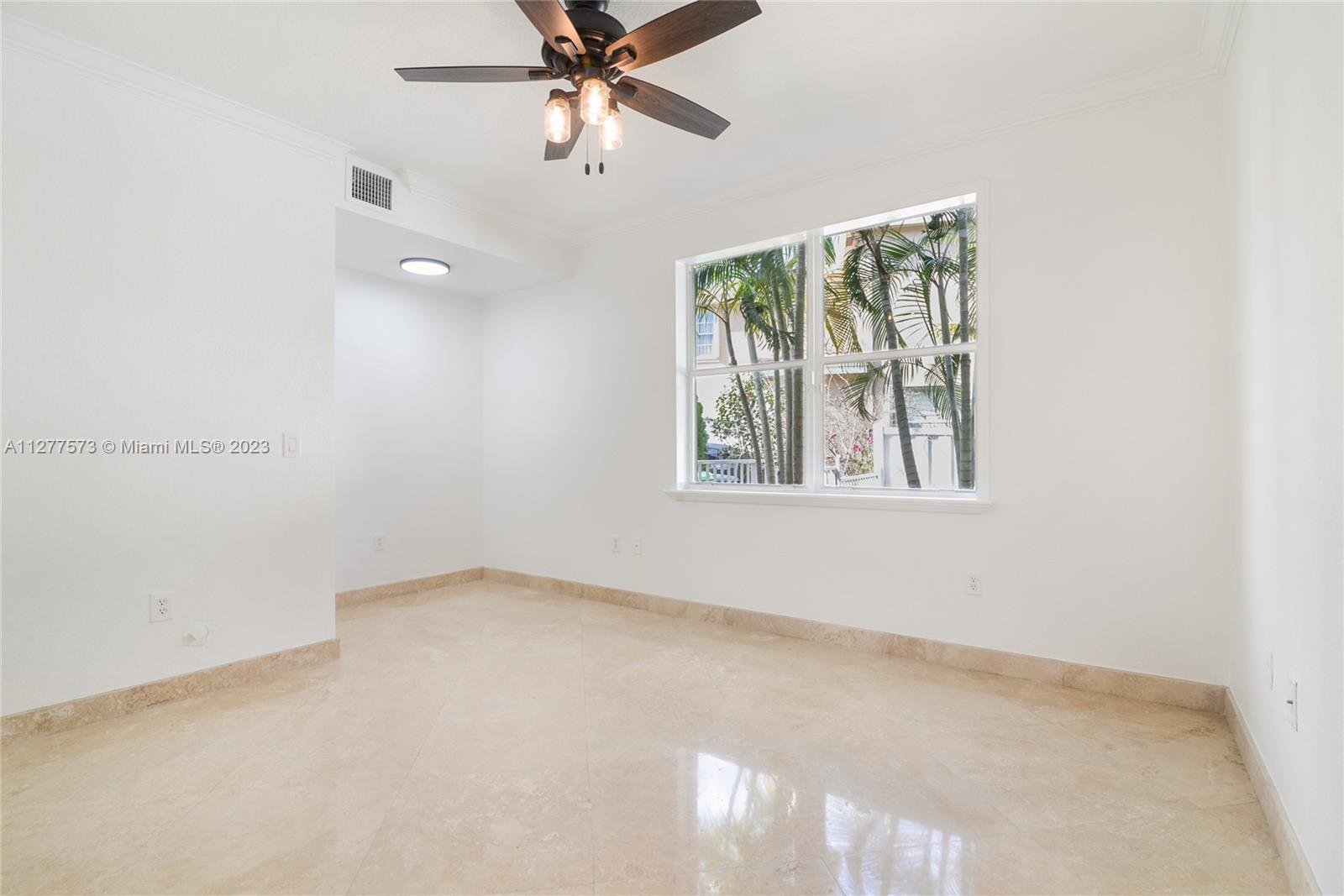 Silver Falls Miramar, FL 33027 - Photo 26 of 46 an empty room with windows and fan view