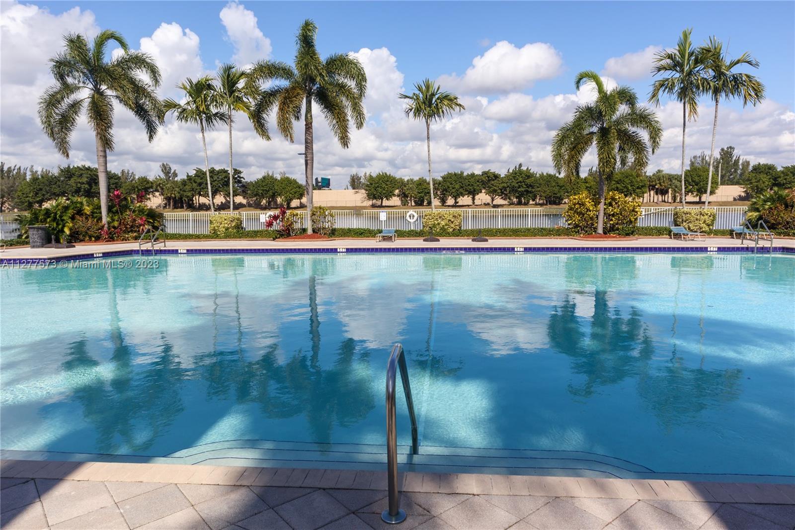 Silver Falls Miramar, FL 33027 - Photo 33 of 46 a view of swimming pool with a table and chairs