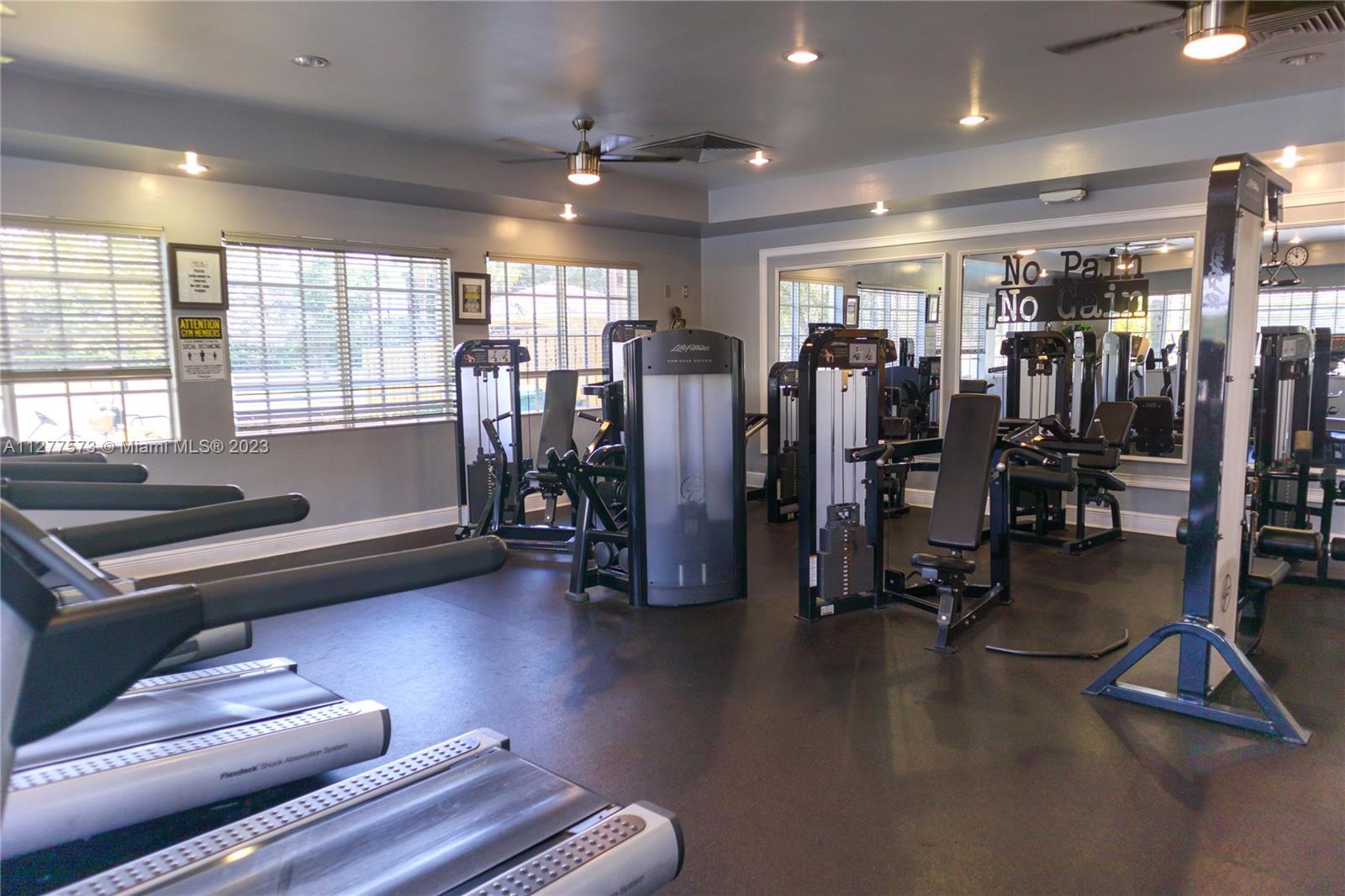 Silver Falls Miramar, FL 33027 - Photo 41 of 46 a livingroom with gym equipment and a large window