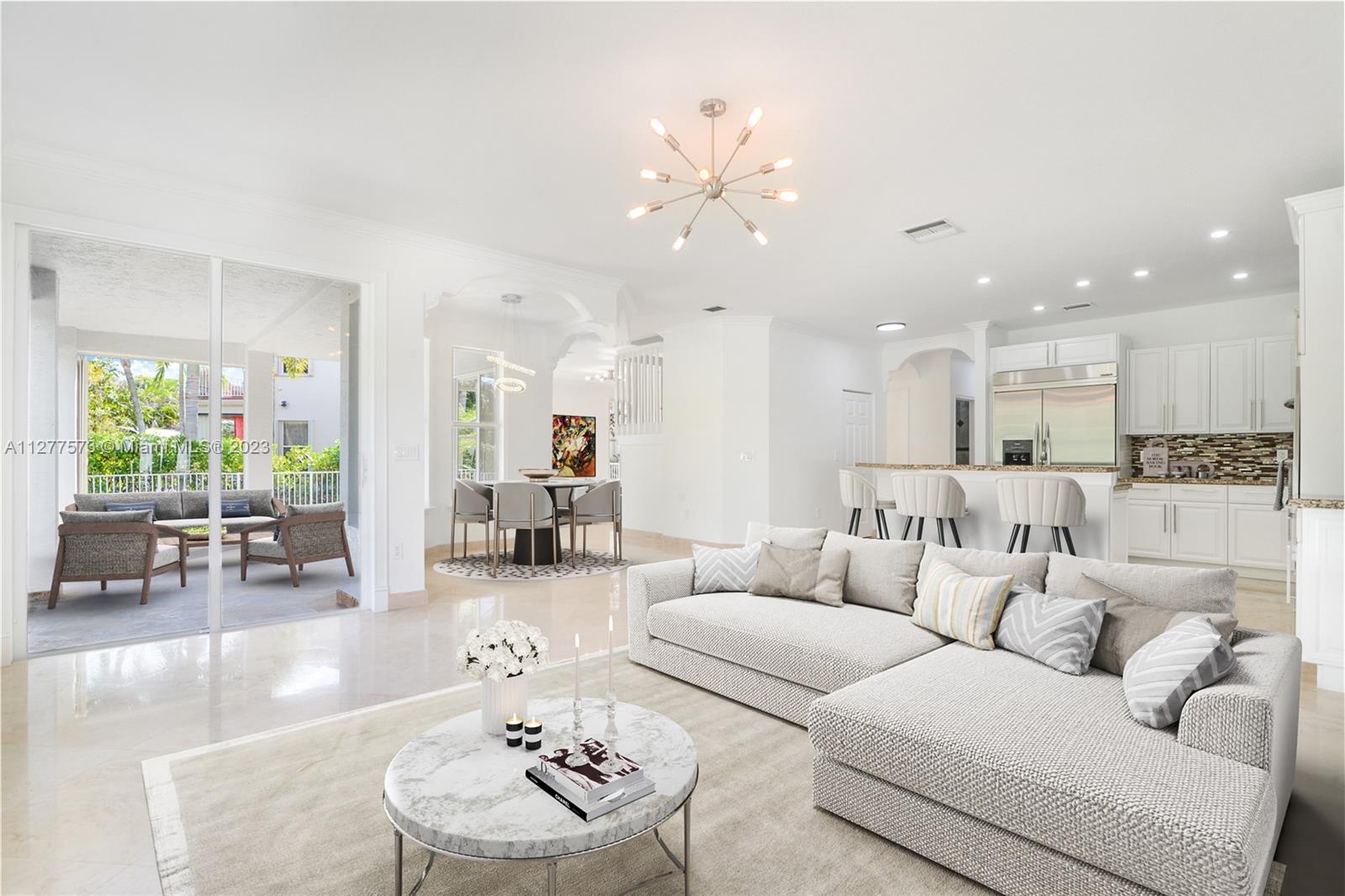 Silver Falls Miramar, FL 33027 - Photo 9 of 46 a living room with furniture kitchen view and a large window
