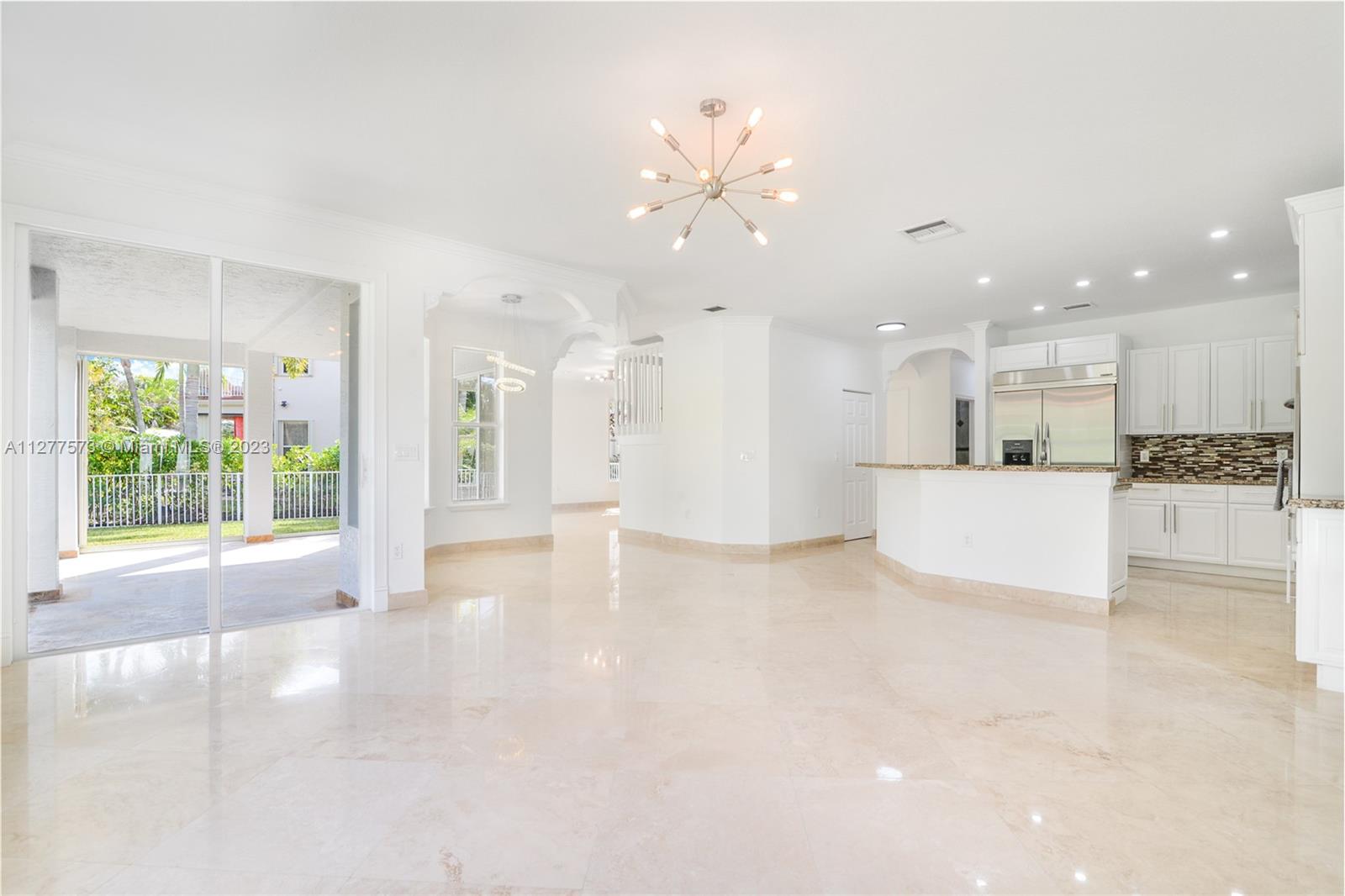 Silver Falls Miramar, FL 33027 - Photo 10 of 46 a view of a kitchen with a sink and a large window