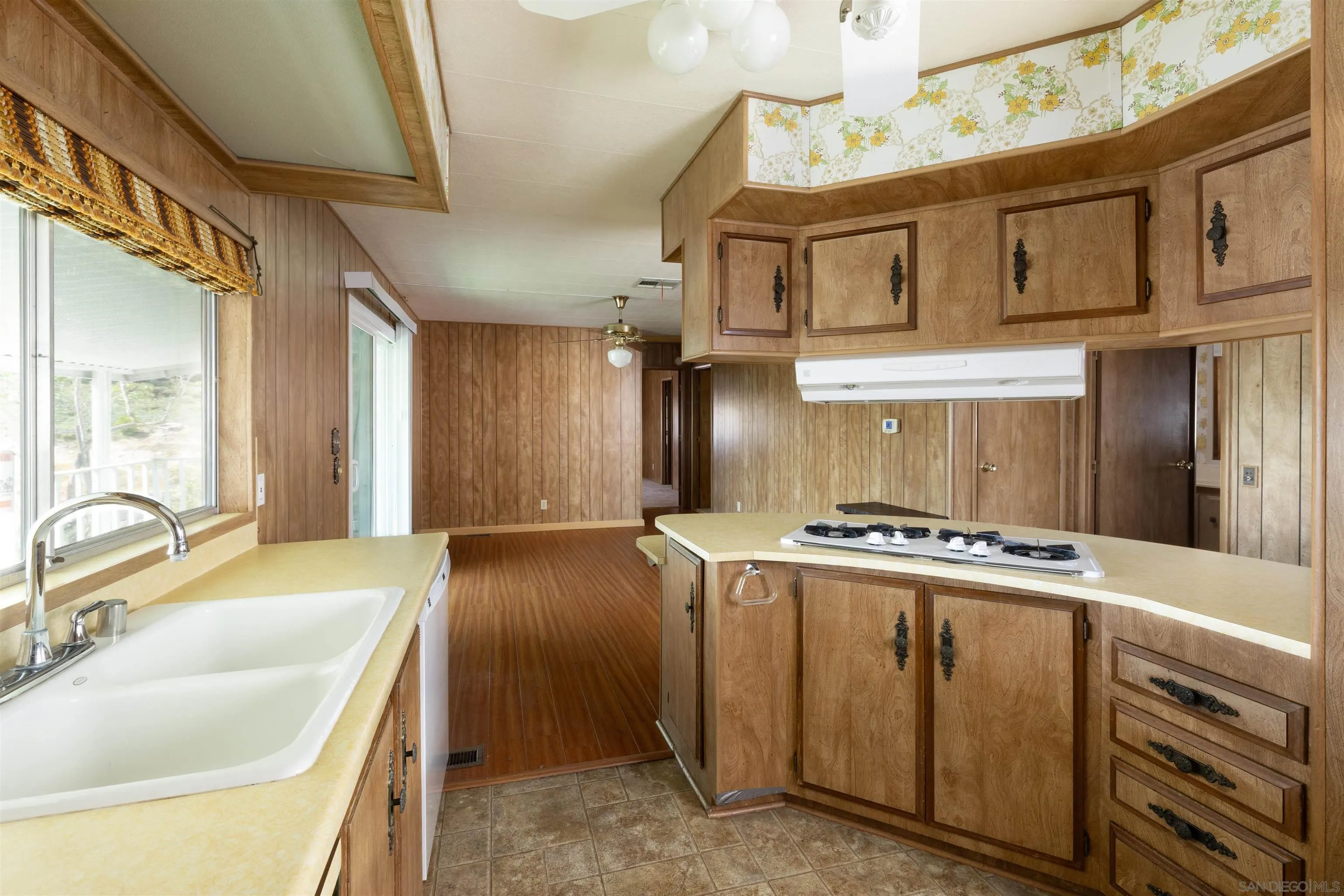 275 South Worthington Street, Unit 105 Spring Valley, CA 91977 - Photo 13 of 25 a kitchen with stainless steel appliances granite countertop a sink stove and refrigerator