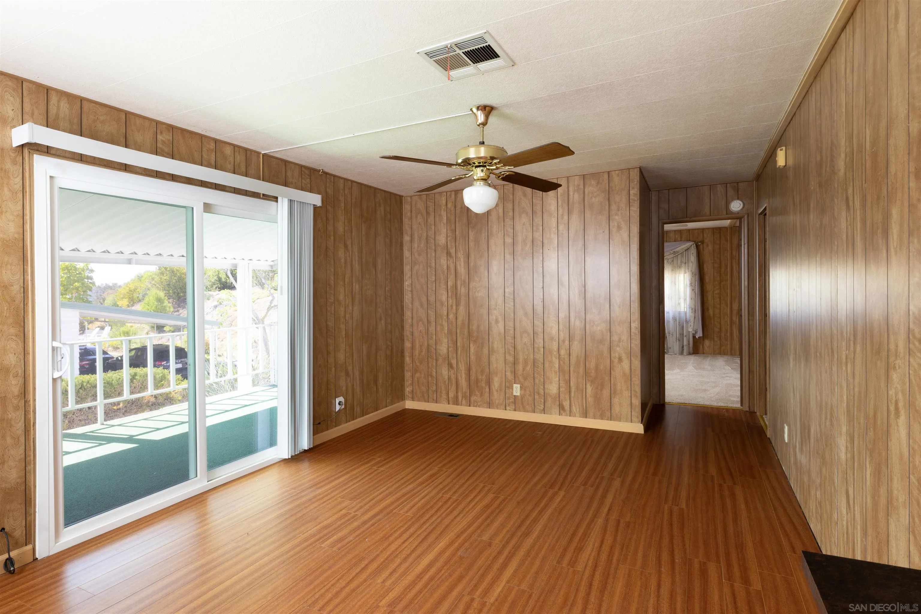 275 South Worthington Street, Unit 105 Spring Valley, CA 91977 - Photo 14 of 25 wooden floor in an empty room with a window