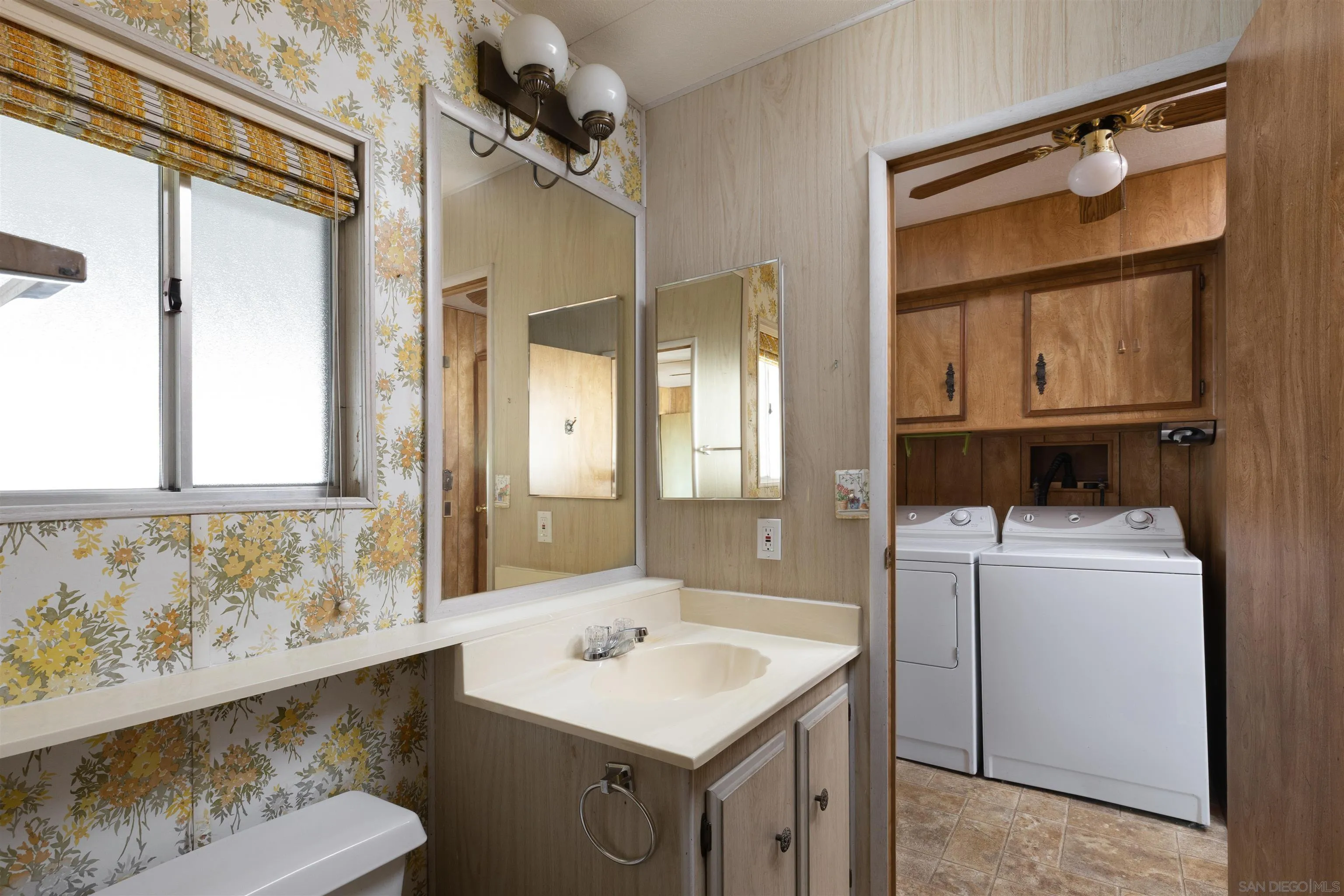 275 South Worthington Street, Unit 105 Spring Valley, CA 91977 - Photo 19 of 25 a bathroom with a sink and a mirror