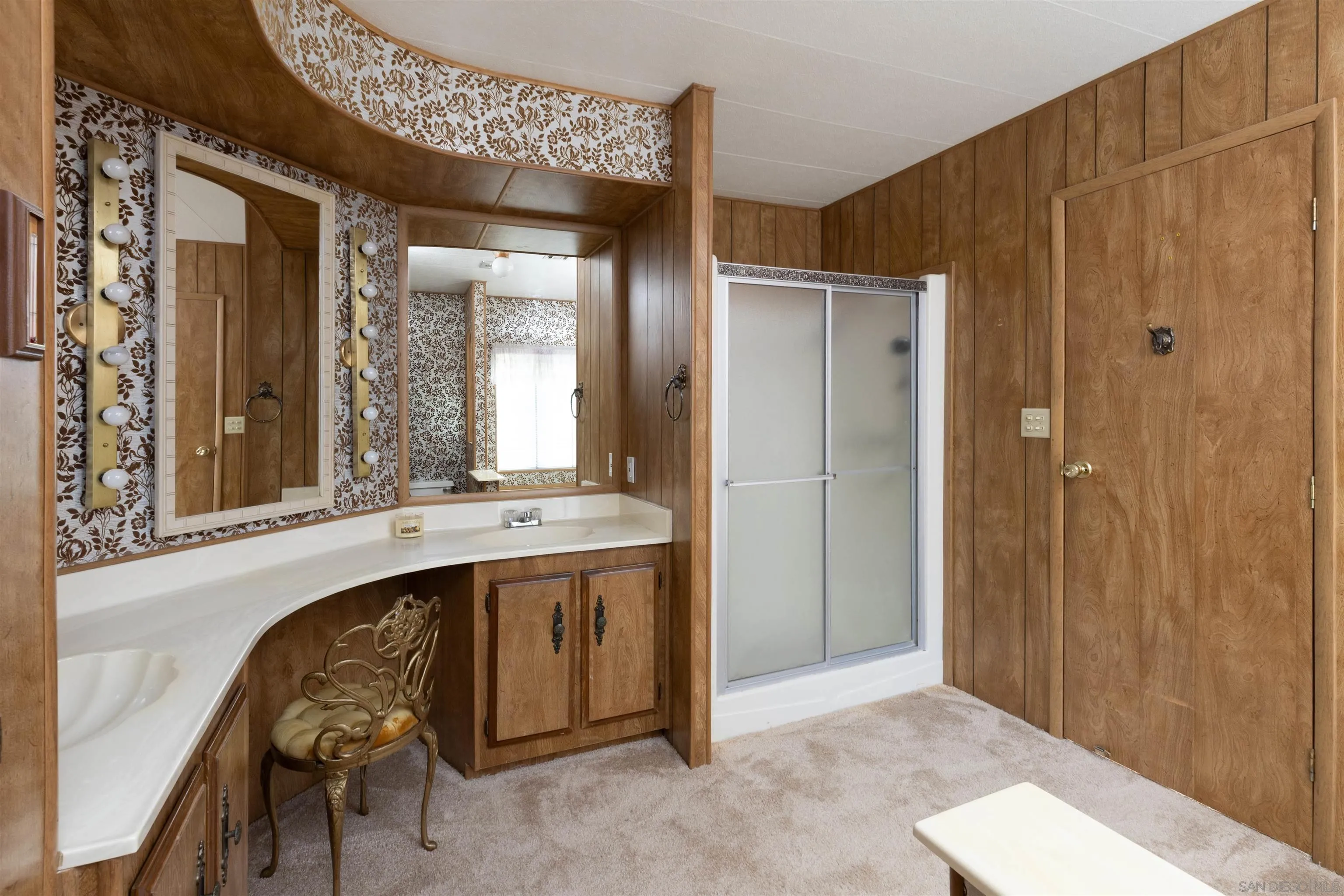 275 South Worthington Street, Unit 105 Spring Valley, CA 91977 - Photo 23 of 25 a bathroom with a sink and a mirror