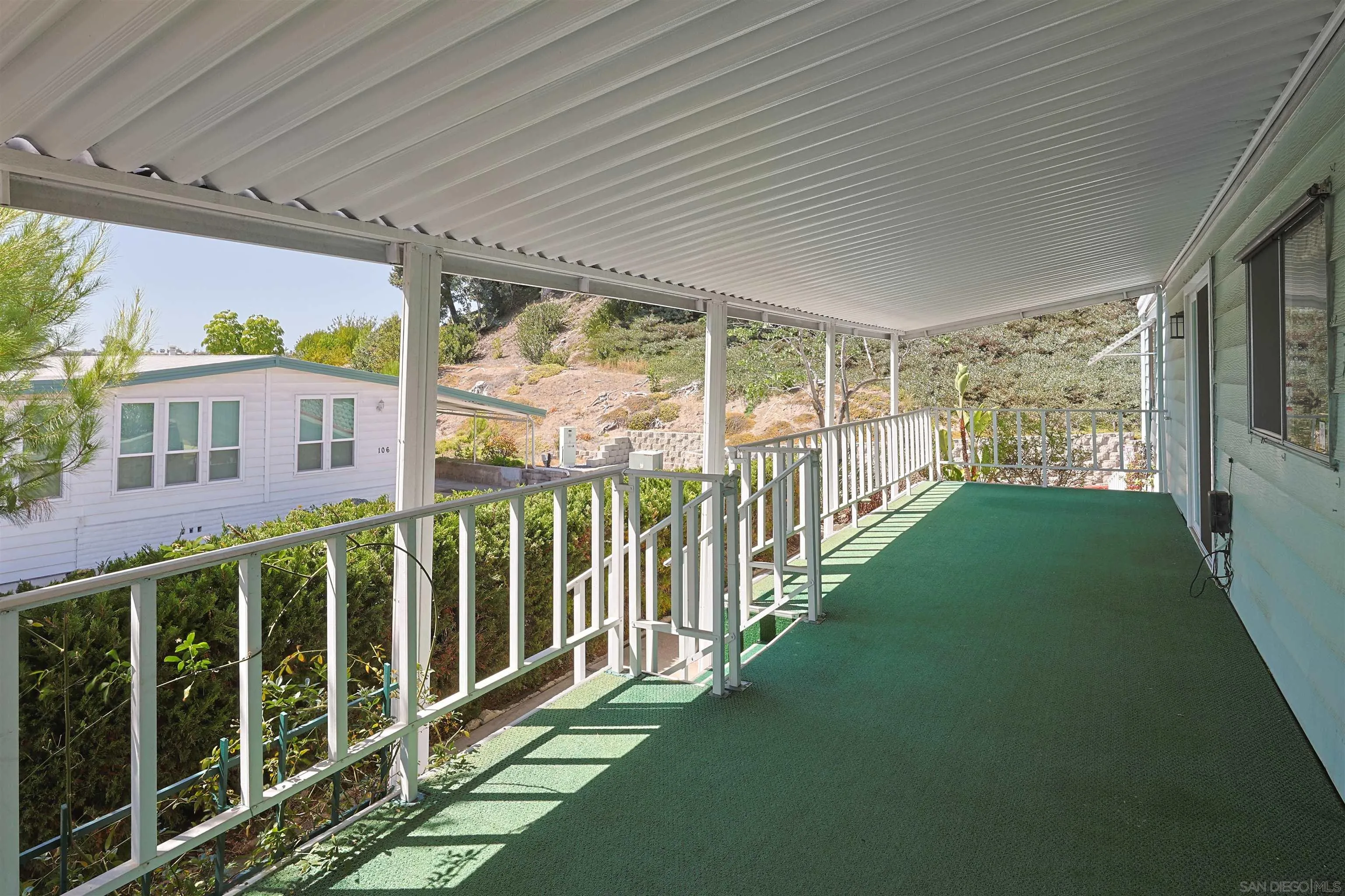 275 South Worthington Street, Unit 105 Spring Valley, CA 91977 - Photo 4 of 25 a view of a porch with wooden floor and fence