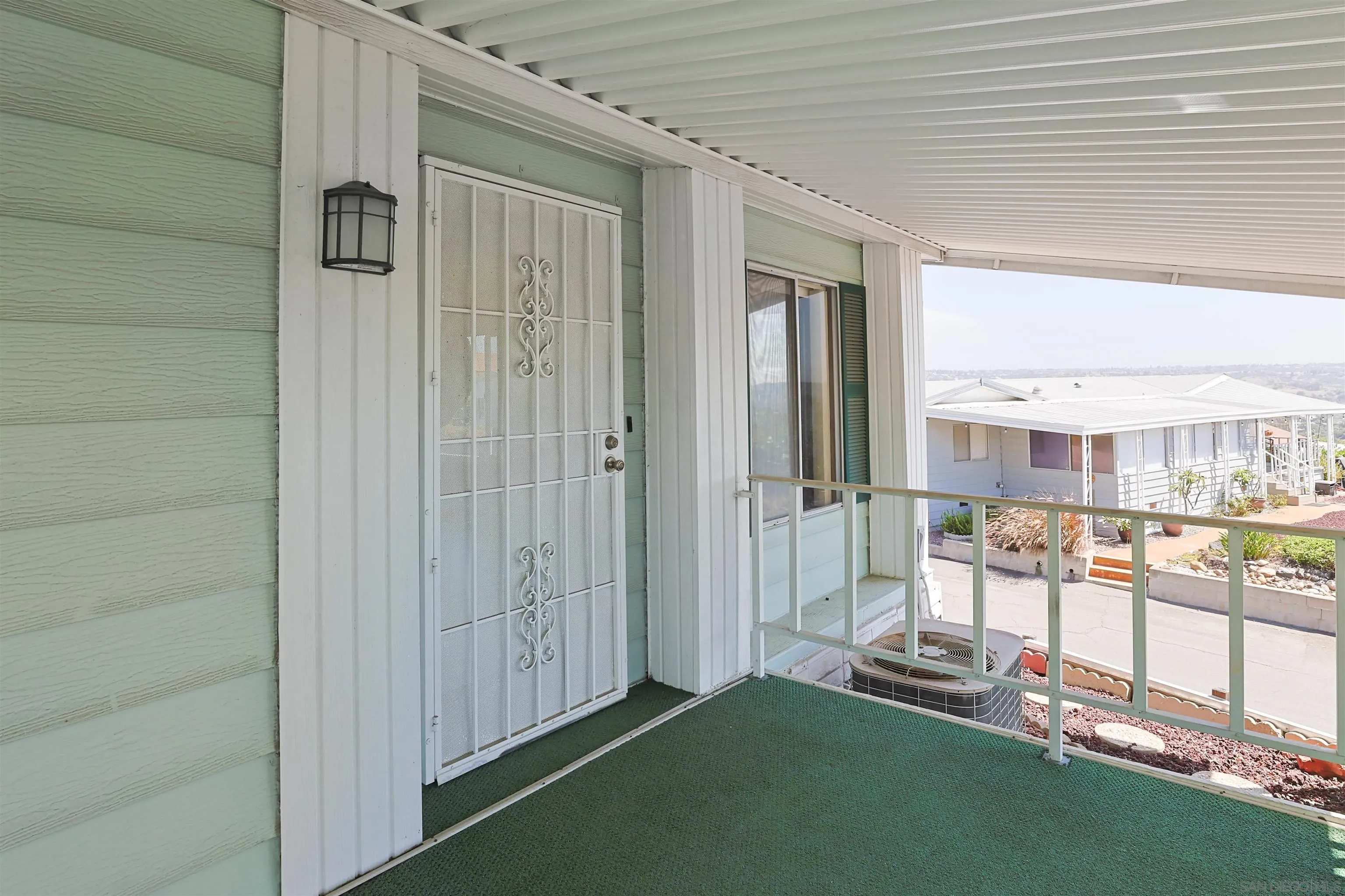 275 South Worthington Street, Unit 105 Spring Valley, CA 91977 - Photo 5 of 25 a view of a porch with a table and chairs
