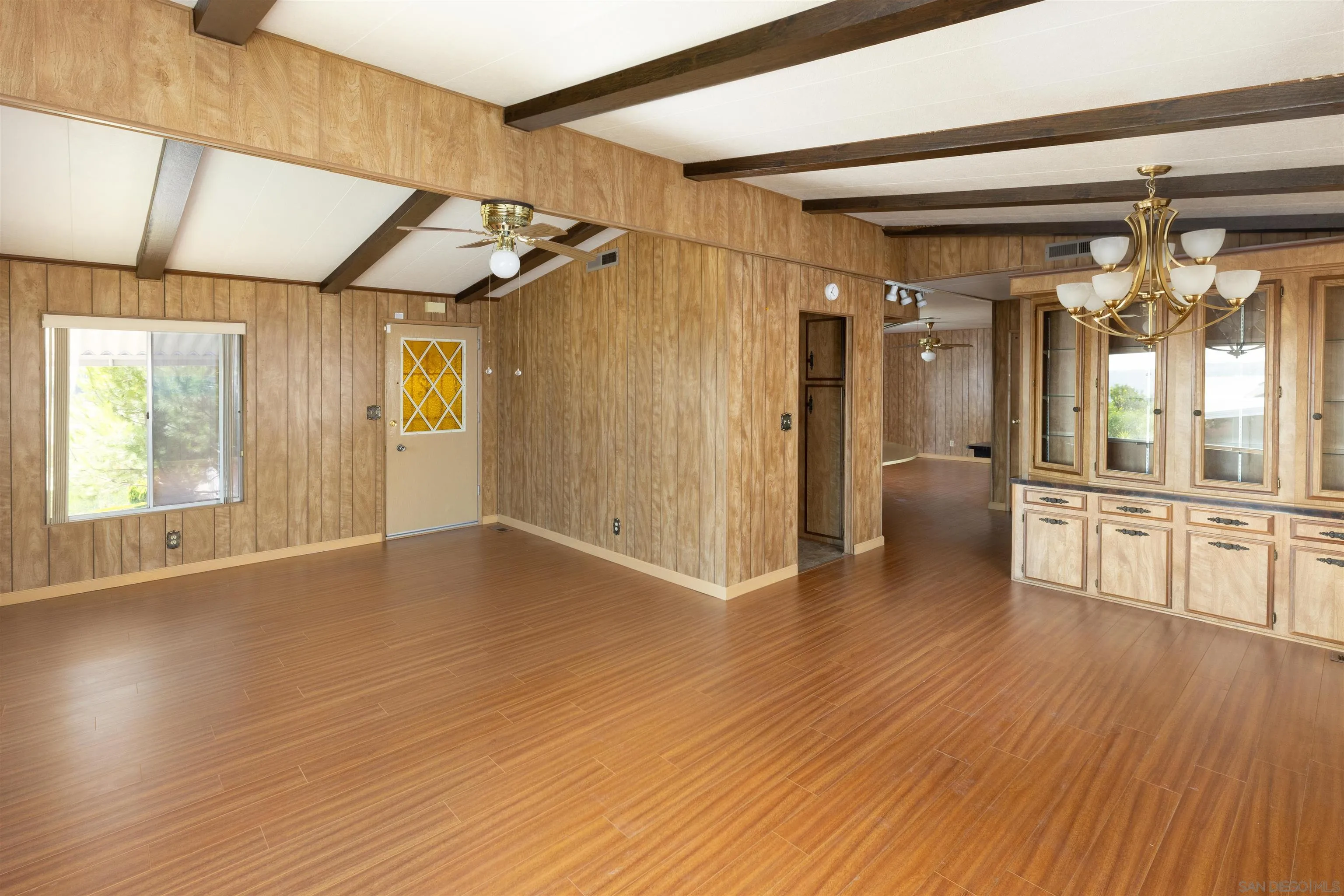 275 South Worthington Street, Unit 105 Spring Valley, CA 91977 - Photo 8 of 25 a view of empty room with wooden floor and fan
