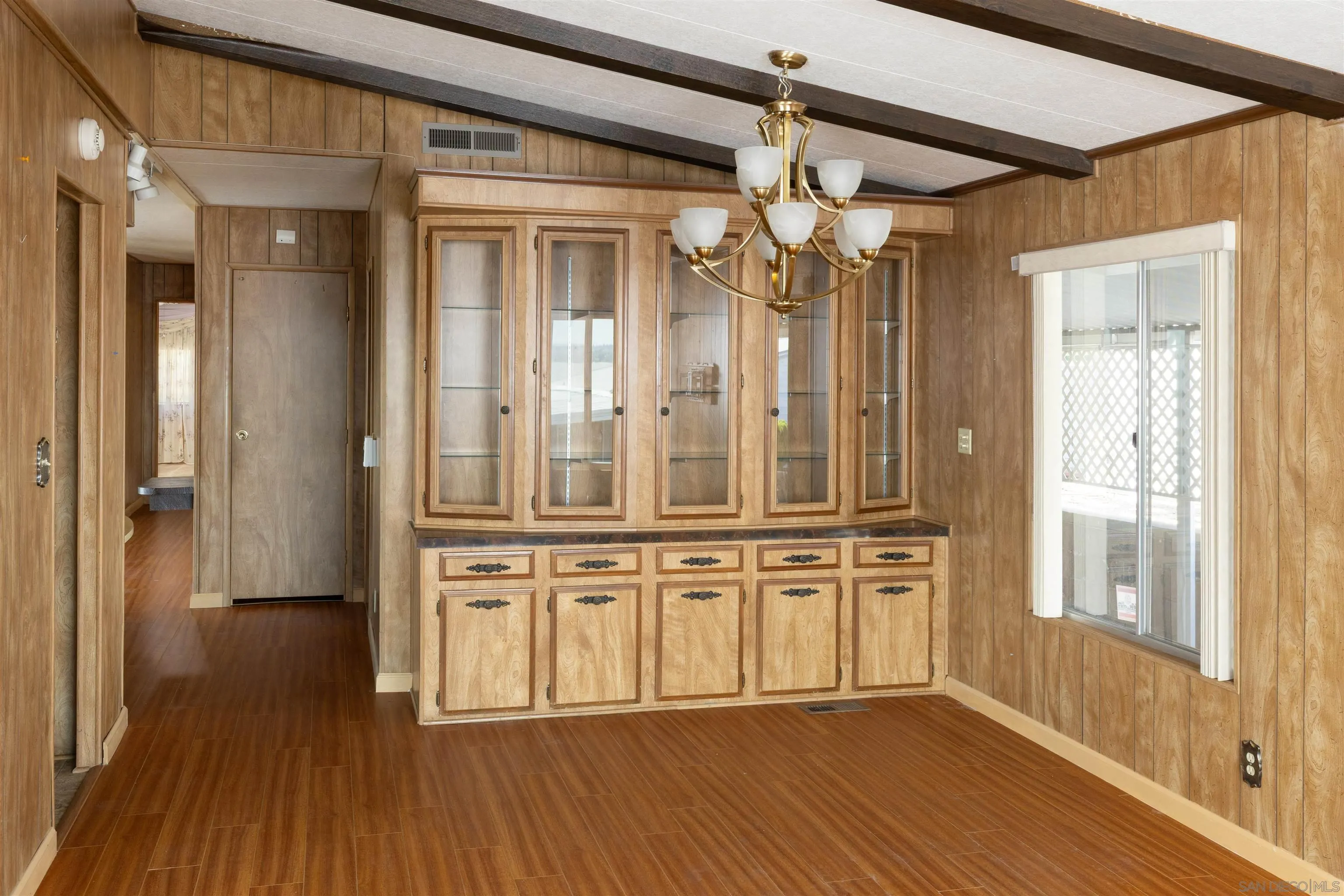 275 South Worthington Street, Unit 105 Spring Valley, CA 91977 - Photo 9 of 25 a view of a hallway with wooden floor and staircase