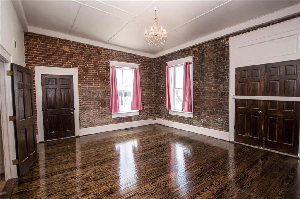 145 South Cherokee Road Social Circle, GA 30025 - Photo 11 of 13 a view of an entryway with wooden floor and a window